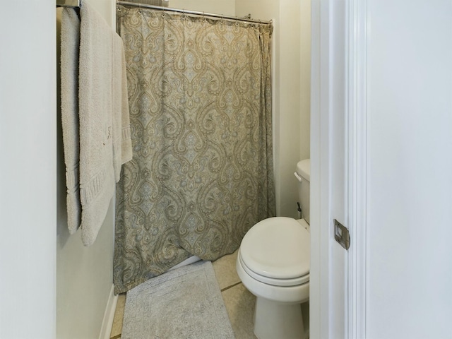 bathroom with tile patterned floors and toilet