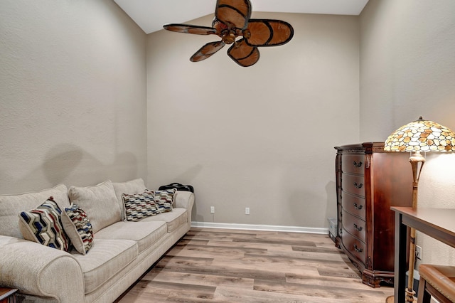 living room with ceiling fan and light wood-type flooring