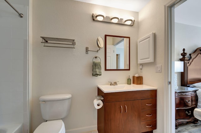 full bathroom with vanity, toilet, and tiled shower / bath combo