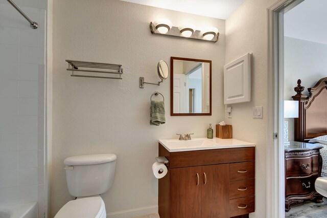 9383 Bridgeport Dr, West Palm Beach, FL 33411 - full bathroom with ensuite bathroom, toilet, vanity, and baseboards
