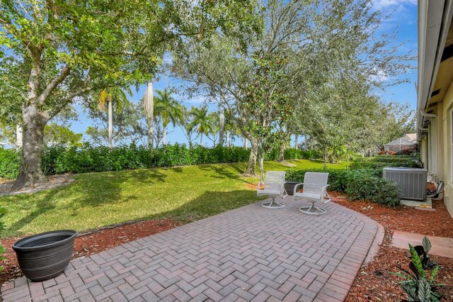 back of property featuring a patio and a lawn