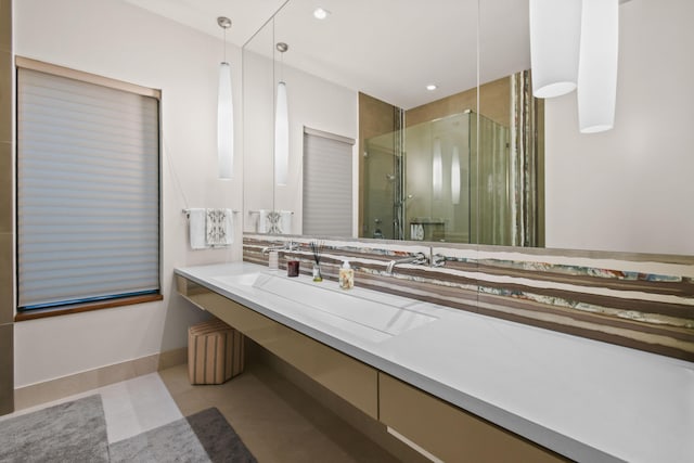 full bathroom with recessed lighting, a shower stall, baseboards, and vanity