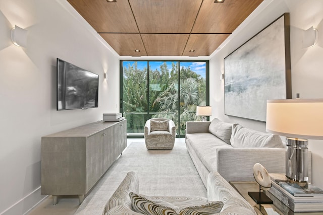 living room with a wall of windows, wood ceiling, and baseboards