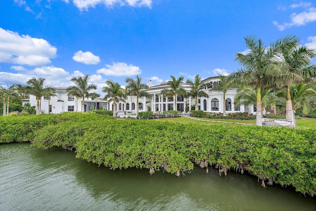 back of house with a water view