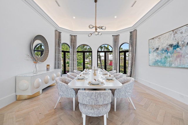 dining space with crown molding, french doors, and light parquet flooring