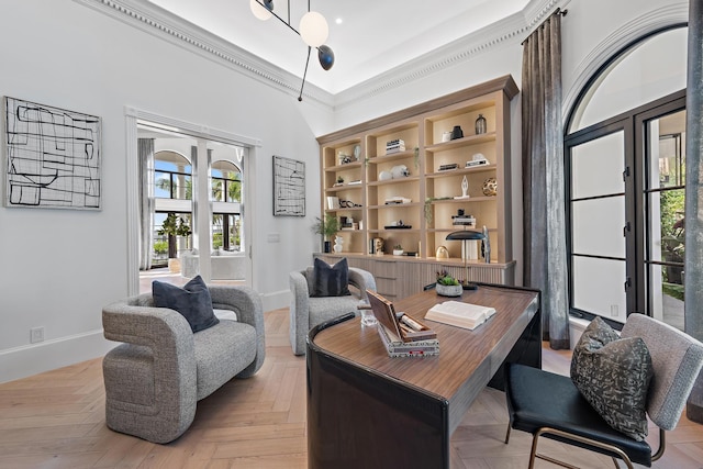 office area featuring light parquet floors and ornamental molding