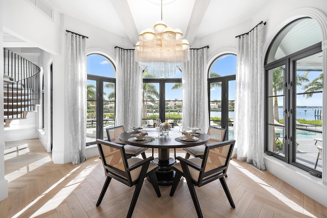 dining space featuring french doors and a healthy amount of sunlight