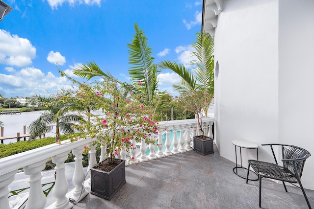 balcony featuring a water view