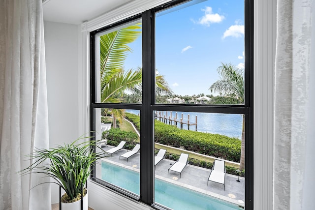 entryway with a water view and a healthy amount of sunlight