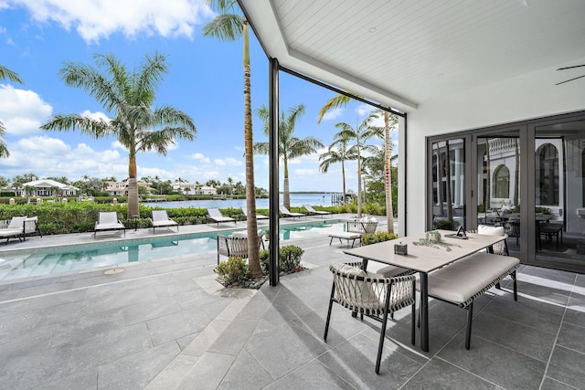 exterior space featuring a patio and a water view