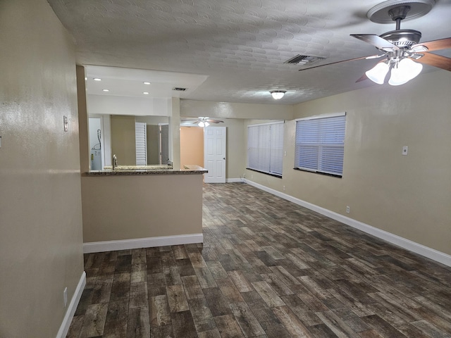 interior space featuring dark hardwood / wood-style flooring and sink