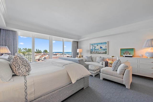 carpeted bedroom featuring access to exterior, crown molding, and a water view