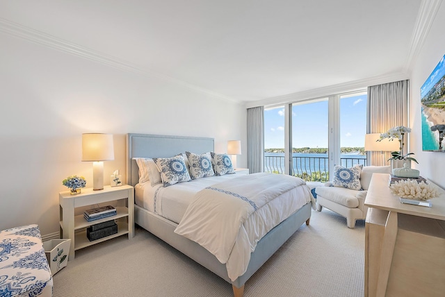 bedroom with access to outside, a water view, ornamental molding, and light colored carpet