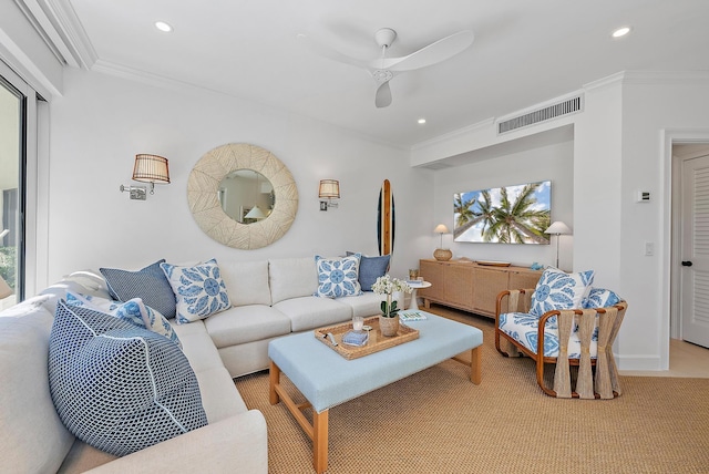 living room with ceiling fan and ornamental molding