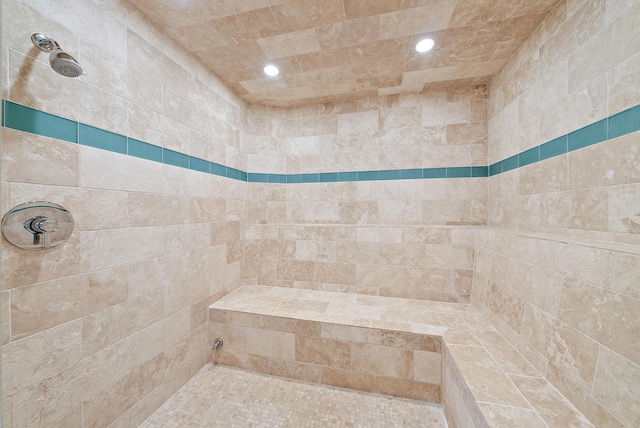 bathroom with tiled shower