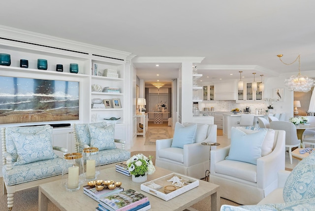 living room with crown molding and a notable chandelier