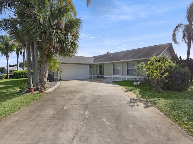 single story home featuring a front yard and a garage