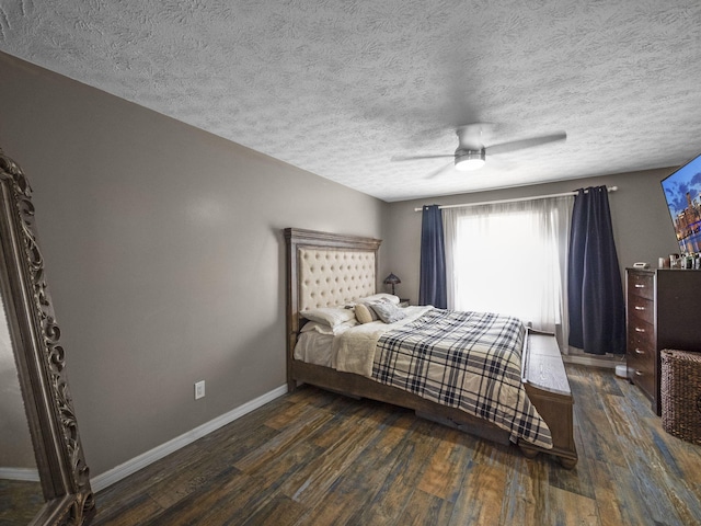 bedroom featuring a textured ceiling, dark hardwood / wood-style floors, and ceiling fan