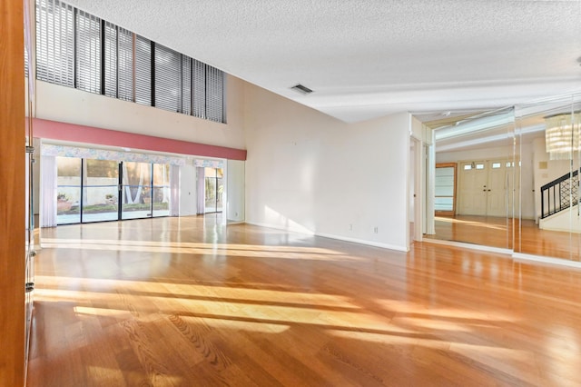 interior space with hardwood / wood-style floors and a textured ceiling