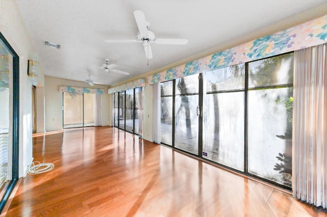 empty room featuring ceiling fan and wood-type flooring