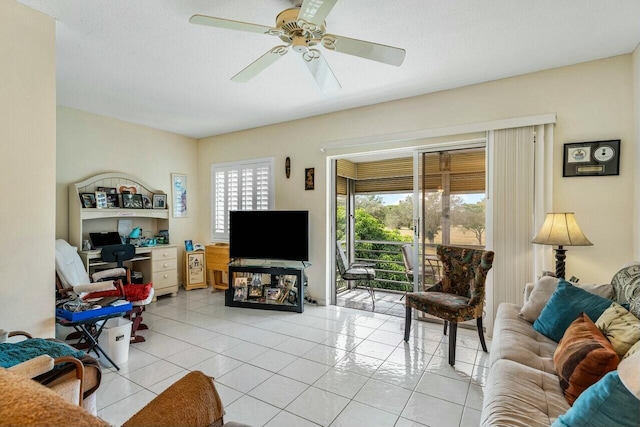 living room featuring ceiling fan and light tile patterned floors