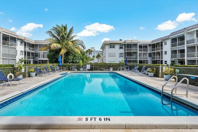 view of swimming pool with a patio area