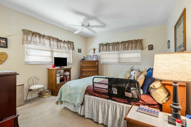 bedroom featuring ceiling fan and light carpet