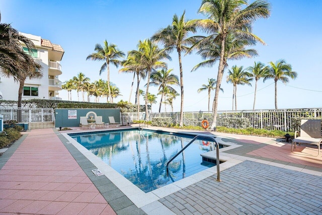 view of swimming pool with a patio