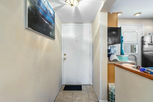 entryway featuring light tile patterned flooring