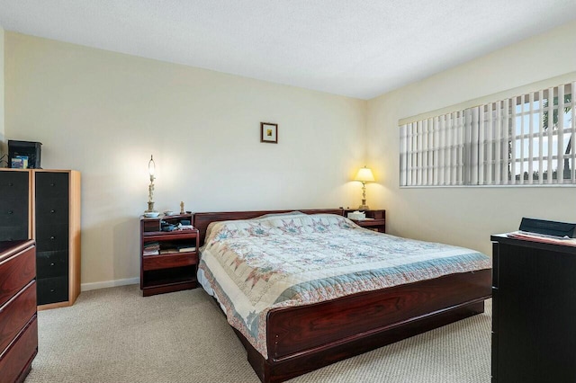 bedroom with light colored carpet