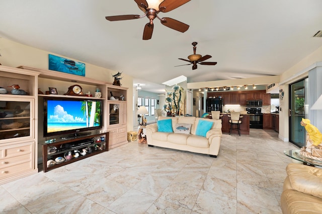 living room with ceiling fan and vaulted ceiling