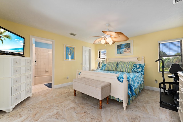 bedroom featuring ensuite bathroom and ceiling fan