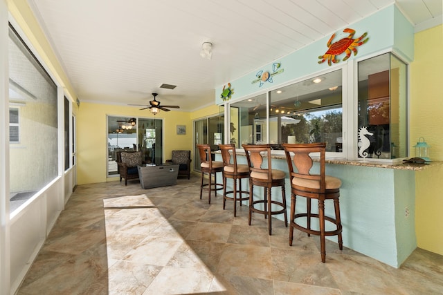 interior space featuring ceiling fan