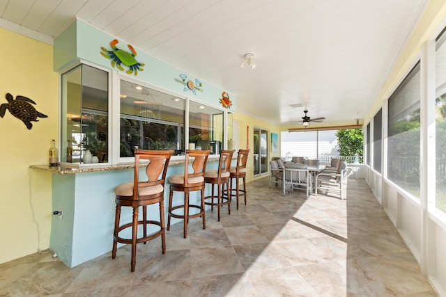 sunroom / solarium with ceiling fan