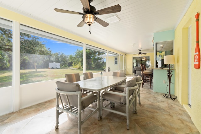 sunroom / solarium featuring wooden ceiling