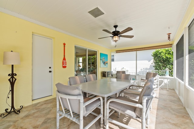 sunroom / solarium with ceiling fan and wood ceiling