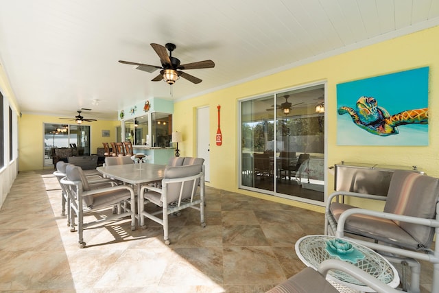 dining area featuring crown molding and a wealth of natural light