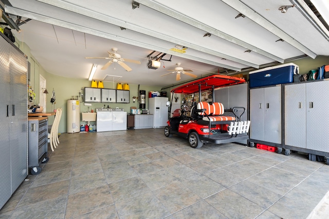 garage featuring ceiling fan, washer and clothes dryer, water heater, a garage door opener, and white fridge with ice dispenser