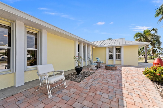 view of patio / terrace with a fire pit