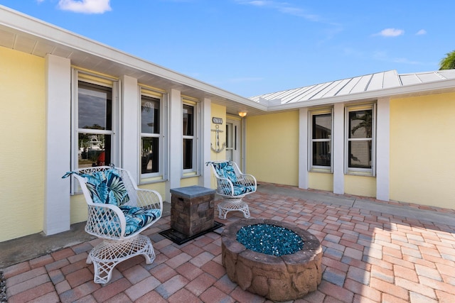 view of patio / terrace featuring a fire pit