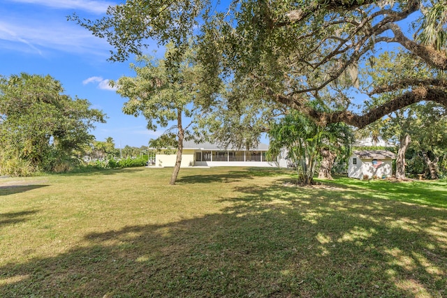 view of yard featuring a sunroom