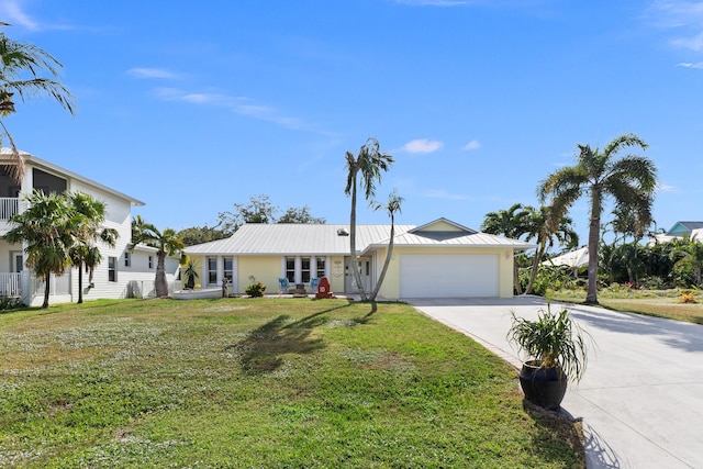 view of front facade featuring a front yard and a garage