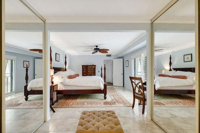 bedroom with light tile patterned floors, ceiling fan, and crown molding