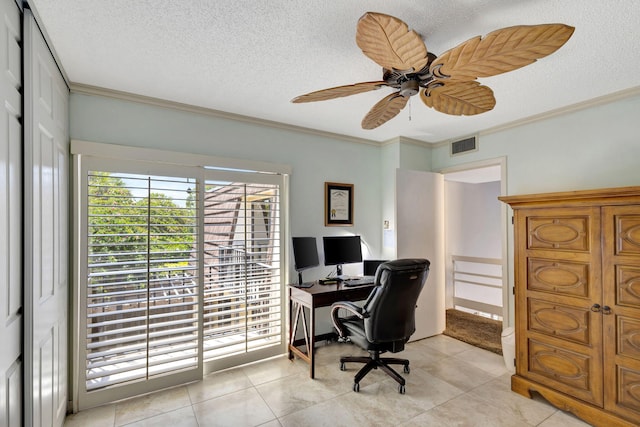 office space featuring ceiling fan, light tile patterned floors, a textured ceiling, and ornamental molding