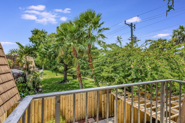 wooden deck with a lawn