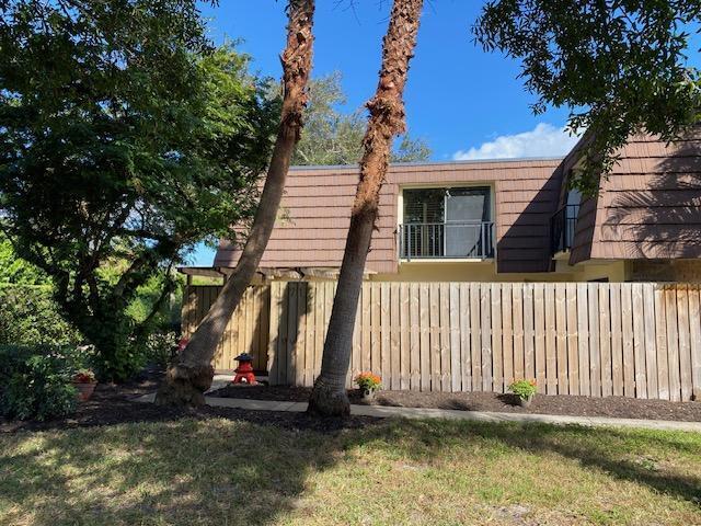 view of side of home featuring a lawn