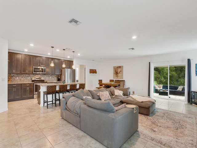 living room with light tile patterned floors