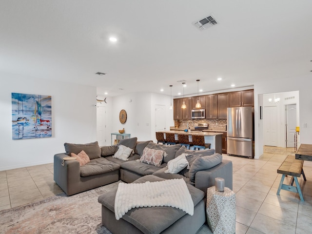 living room with light tile patterned floors