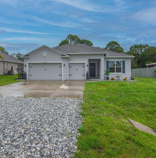 single story home with central AC unit, a garage, and a front lawn