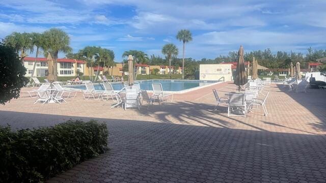 view of swimming pool featuring a patio area